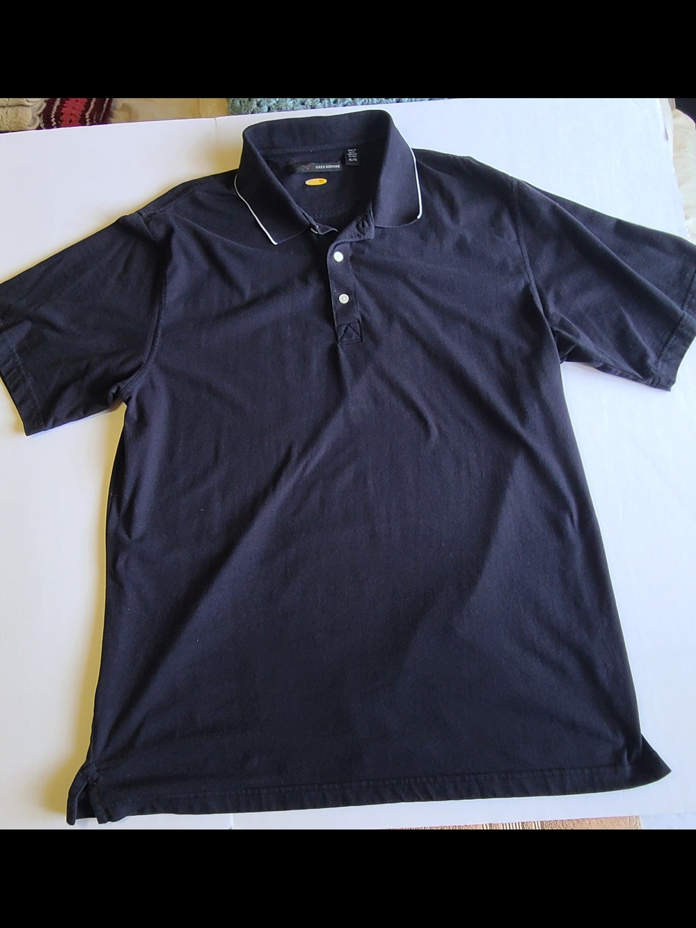 Greg Norman PlayDry Collection Black Polo with White Piping size XL.